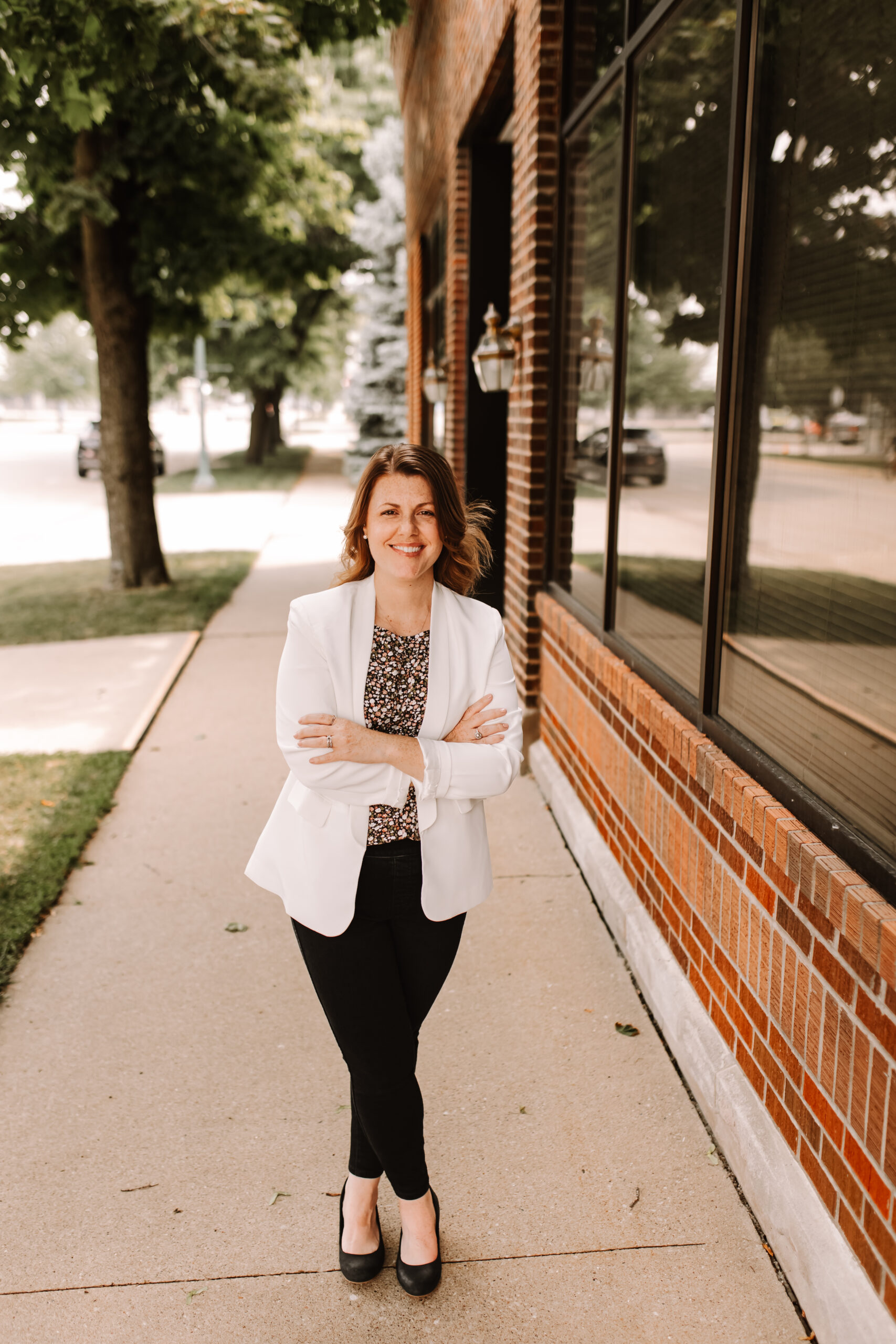 Lindsay on sidewalk downtown Cedar Falls